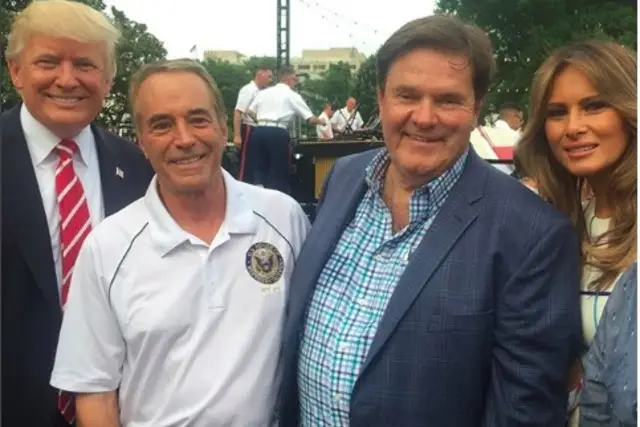 Rep. Chris Collins posing next to President Trump on the day he allegedly committed securities fraud.